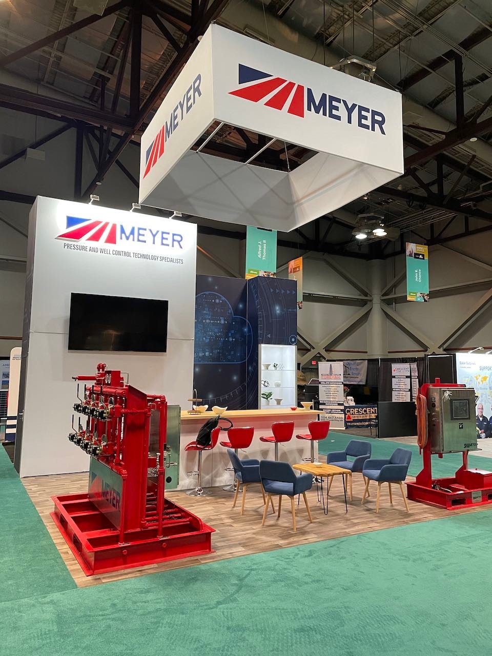 Meyer island exhibit with a hanging sign, red equipment displays and a lounge